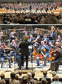 Blick auf die Bühne der Isarphilharmonie mit Musikern und Dirigenten